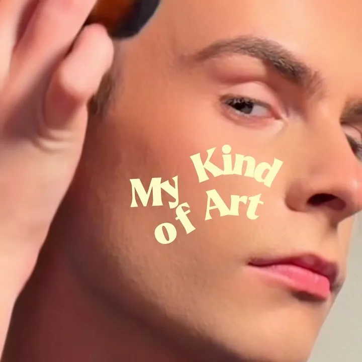 Close-up of a stylist applying finishing product to a men’s haircut