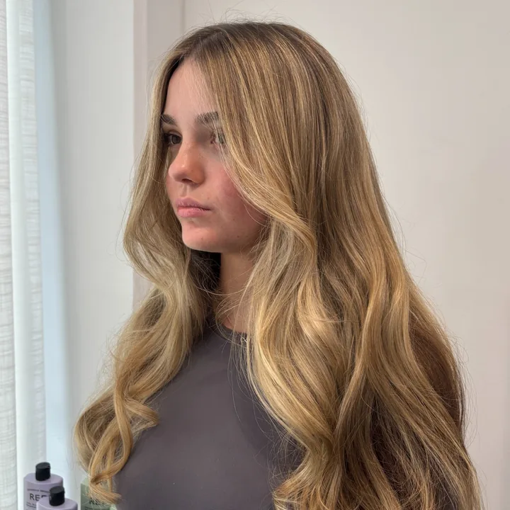 Long dimensional blonde hair with soft face-framing layers